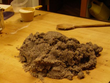 The lumpy dough dumped out on a counter.